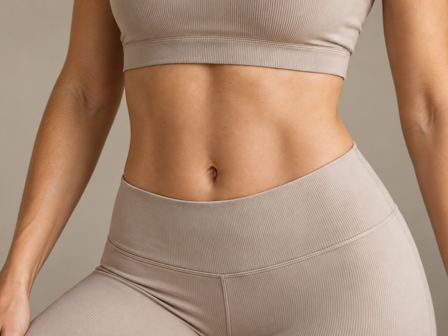 Abdomen in neutral beige sportswear